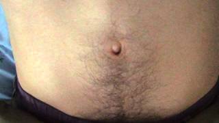 Young guy belly button play