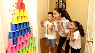 Kids Play With Colored Cups and Surprise Eggs with Toys
