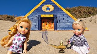 Elsa and Anna toddlers find a treasure in a pyramid