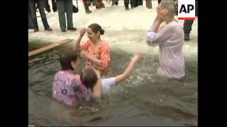 People swim in frozen lake to celebrate Orthodox Epiphany