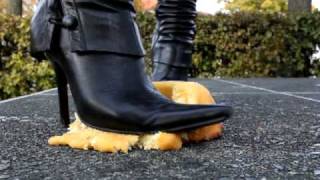 Mistress Charis crushes a Cake with Boots (Part 1 of 3)