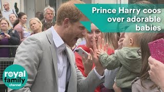 Prince Harry coos over adorable babies
