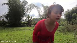 Primitive life: Primitive people stealing fish in trap of ethnic girl