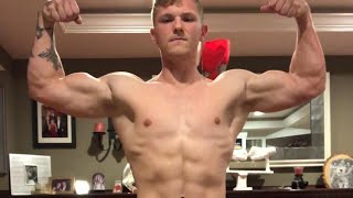 Teen boy flexing muscle