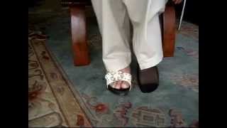 male amputee with artificial foot dresses in black nylon