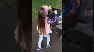 Девочка катает реборна в коляске