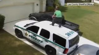 Watch: Man dances on deputyâs car to ward off vampires