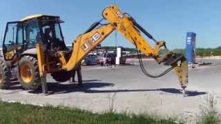 Бетонная плита против экскаватора JCB с гидромолотом  - steh39.ru
