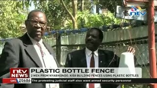 Two men build fences using plastic bottles Nyabikondo, Kisii