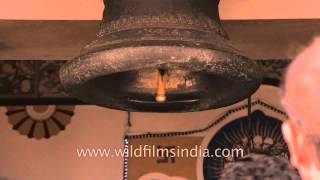 Devotees touching the temple's bell at Birla Mandir