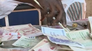 ZIMBABWE'S DOLLARS AS FASHION ITEMS - BBC NEWS