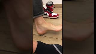 Sergio removes his shoes, socks, shows his size 14 US feet