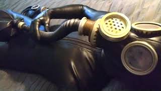 Breathplay in tight rubber latex catsuit and gas mask