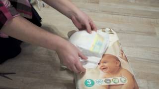 Распаковка Подгузники Pampers Premium Care 3 (Midi) 5-9 кг, 60 шт (4015400274780) из Rozetka.com.ua