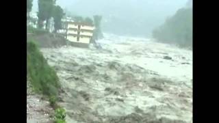 India monsoon: torrential rains washes away apartment block