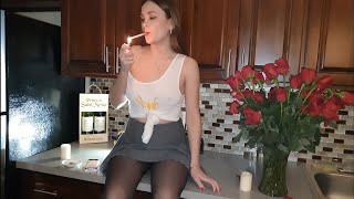 Sexy girl smoking in the kitchen