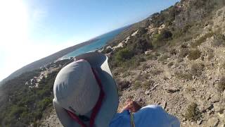 Barefoot hiking over thorny brush in Crete, on island of Gavdos