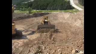 Cat 245B Excavator & Cat D11N Dozer dig for pipeline