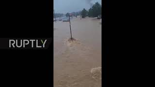 USA: Flash floods drag debris over roads in Waverly
