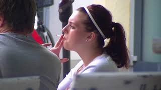 Beautiful woman with pearl earrings smokes in public (1/2)