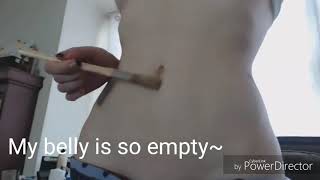 Slim girl teases her empty stomach