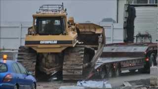 Bulldozer slips off truck