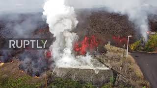 Spain: Drone footage shows lava reaching residential area in La Palma
