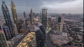 Skyline of the buildings of Sheikh Zayed Road and DIFC aerial night timelapse in Dubai, UAE.