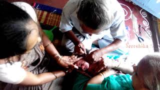 Ear piercing video of Seershika ( Chevulu kutte video) at the age of 21 days