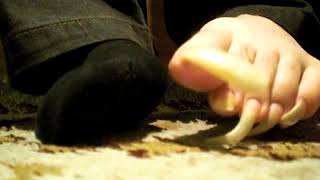 Moving my long toenails before i go sleeping.