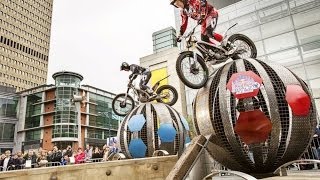 Urban trial riders race through obstacles in Manchester