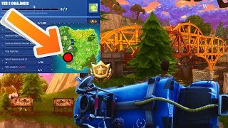 FORTNITE - CERCA TRA UN PONTE DI METALLO, TRE MANIFESTI E UN BUS DISTRUTTO