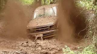 HUGE CHEVY S-10 4X4 MUD TRUCK ON 54" BOGGERS BLASTIN THROUGH MUD HOLE!!