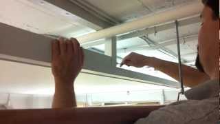 Back-lit stretch ceiling light panel on hinge system