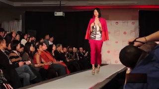 Two models trip on very high heels during Jasper Huang Fall/Winter 2013 fashion show
