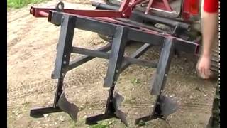 Нива на гусеничных движителях Wheeltracks с плугом.