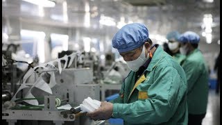 Shanghai factories work on holidays to ensure mask supply