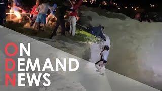 Migrants CLING to Cliff Face After Boat Runs Aground