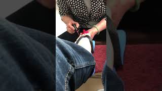 Guy getting long toenails painted at salon