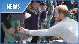 Prince Harry gives shy boy a tummy tickle
