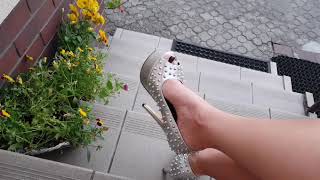 Fetish LadyIVe  in silver high heels smokes a cigarette