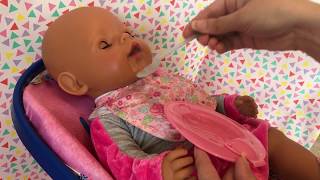 Baby Born Interactive doll feeding baby Born food and changing