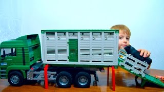 Брудер грузовик MAN для перевозки животных с быком #02749 Bruder Toys Transportation Truck