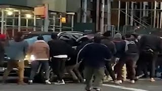 Video: Passersby lift SUV off woman run over in Manhattan