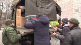 Армия ДНР и "Дорога Добра" выдает помощь семьям погибших солдат