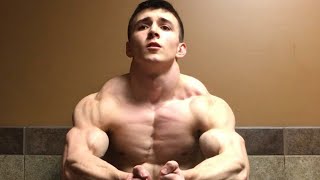 Young muscle guy flexing