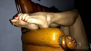 Miss Feety show her sexy legs, hot soles and feet with red hypnotic toenails