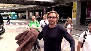 EXCLUSIVE:  Simon Baker having fun with us as he arrives at Nice airport for the 2015 Cannes festiva