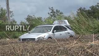 USA: Hurricane Ida leaves cars buried in mud at New Orleans petrol station