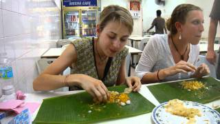 Eating delicious Indian food served on a banana leaf the proper way